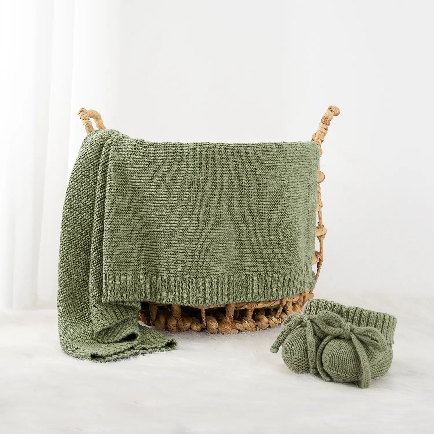 Close detail of sage cotton knit baby blanket texture