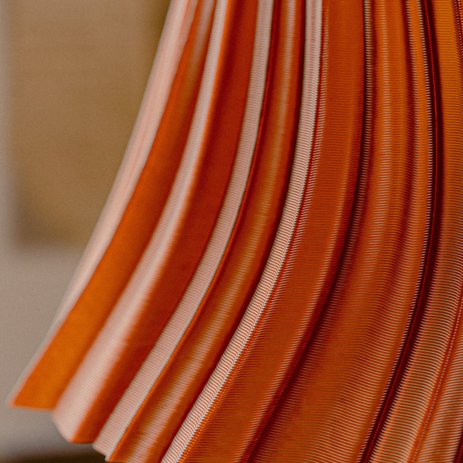 Pleat table lamp photographed in a styled interior.