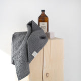 Three-piece dark grey waffle towel set for bath and guest spaces