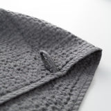 Waffle weave hand towel and bath textile in dark grey