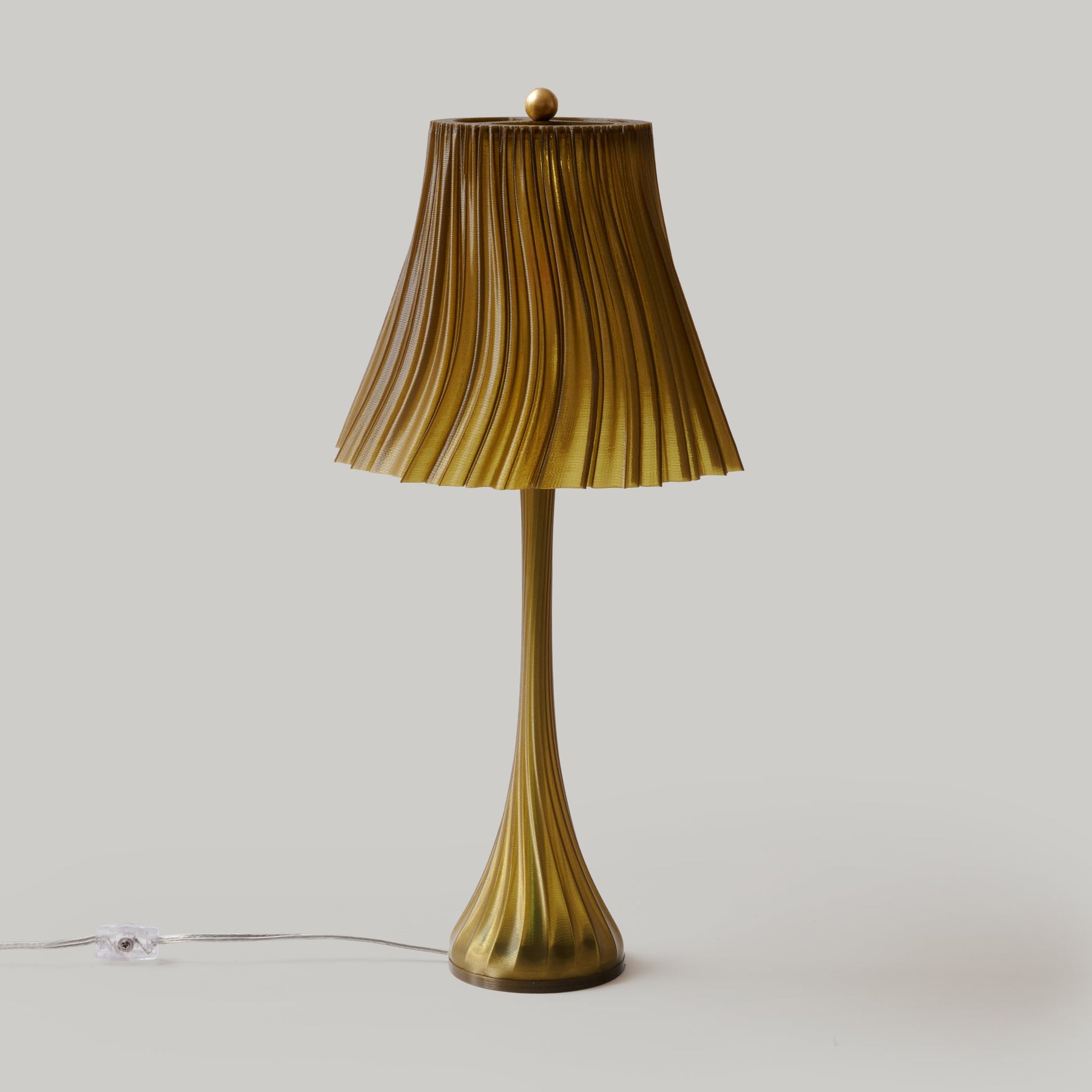 Pleat table lamp showing soft warm ambient light