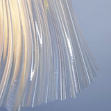 Pleat table lamp shown in a tall ambient-light setting.
