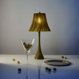 Pleat table lamp styled on a warm home surface