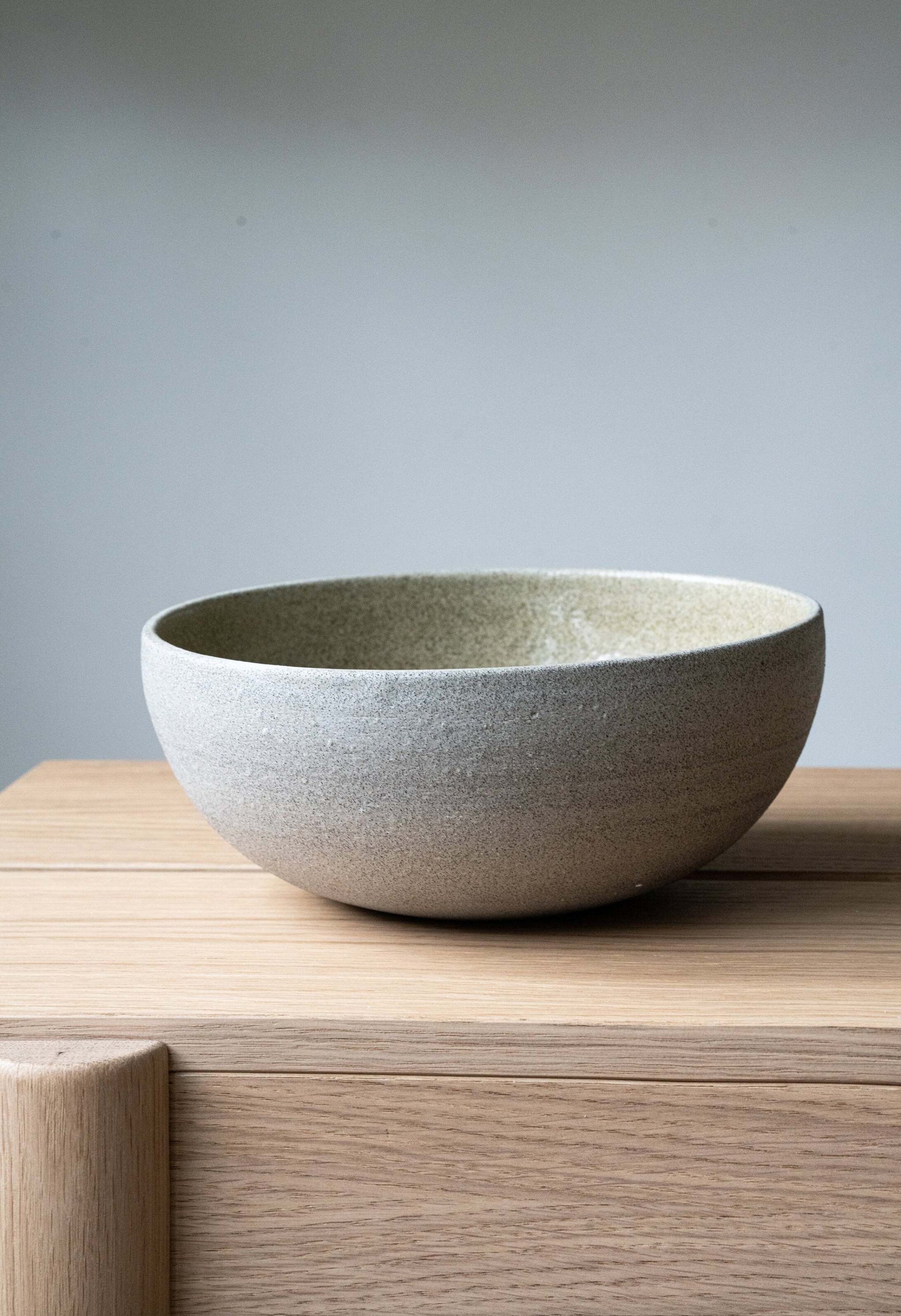 Three concrete-inspired stoneware bowls nested by size