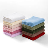 Soft cotton baby blanket folded as a thoughtful newborn gift