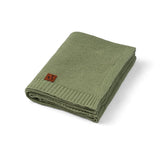 Sage cotton knit baby blanket folded for nursery styling