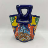 Handmade Talavera utensil holder showing colorful glaze detail