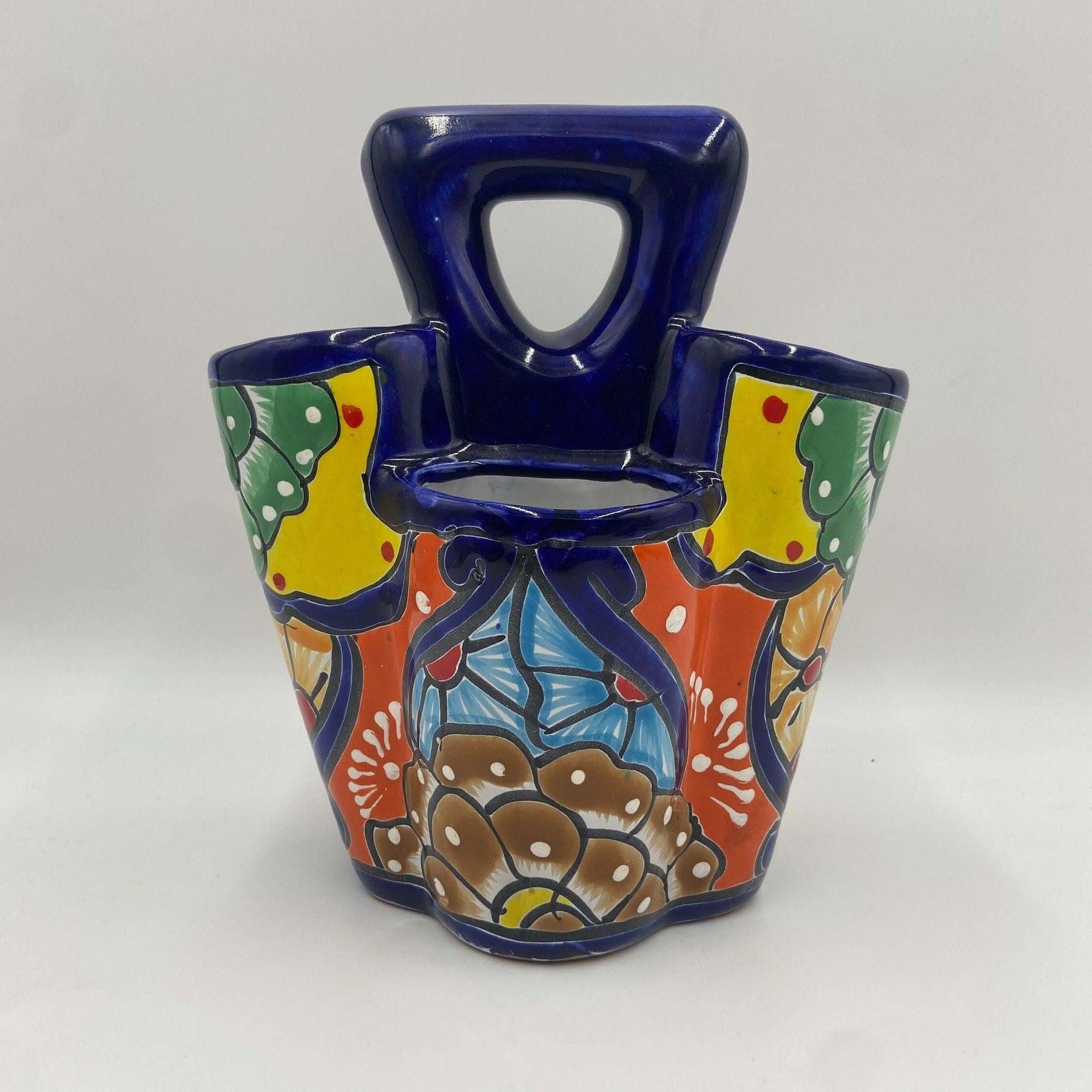 Handmade Talavera utensil holder showing colorful glaze detail