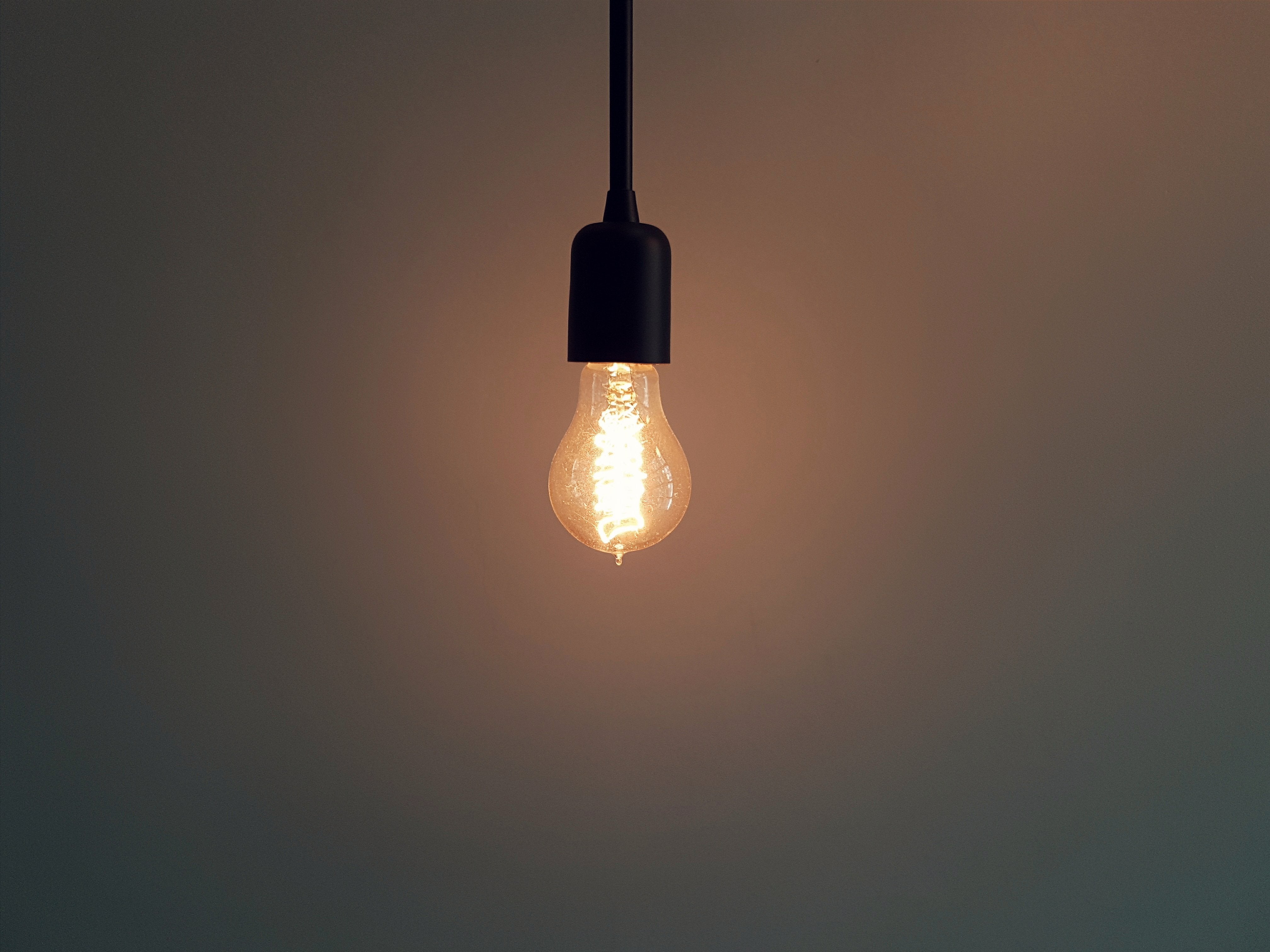A warm lightbulb representing answers and support